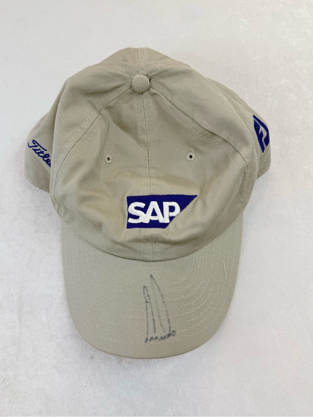 Ernie Els autographed Titleist Beige Baseball Cap with Blue SAP Logo
